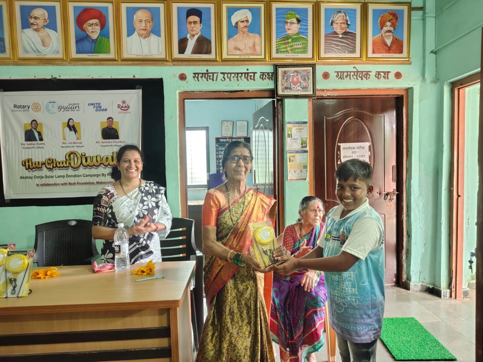 Village gathering and solar handover